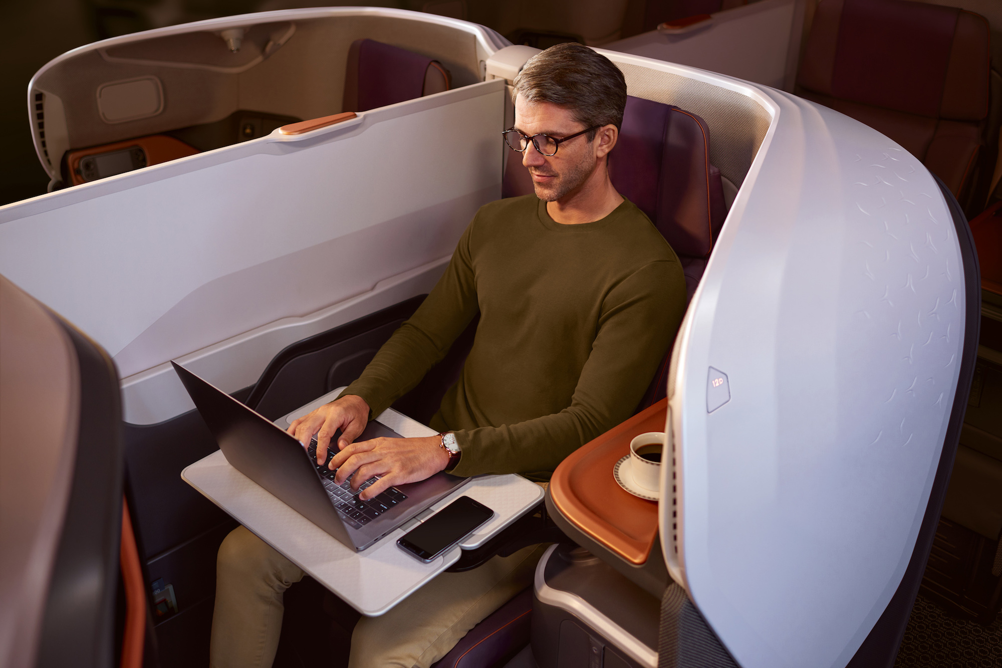Man on Laptop (Singapore Airlines)